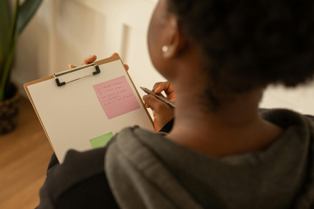 A Woman Holding a Clipboard and a Pen